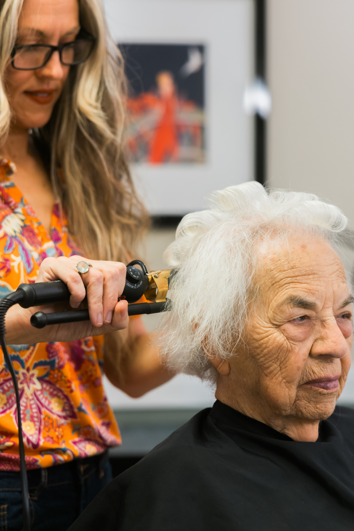 resident getting hair styled in salon portrait